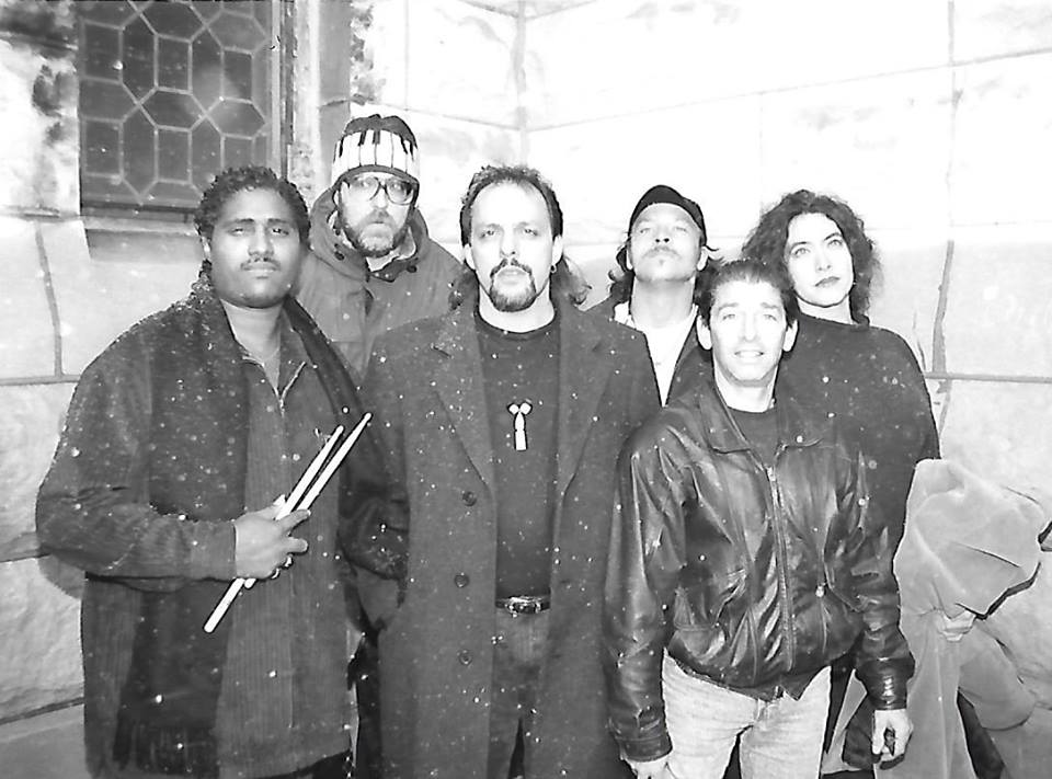 Group of people posing in snowy setting.